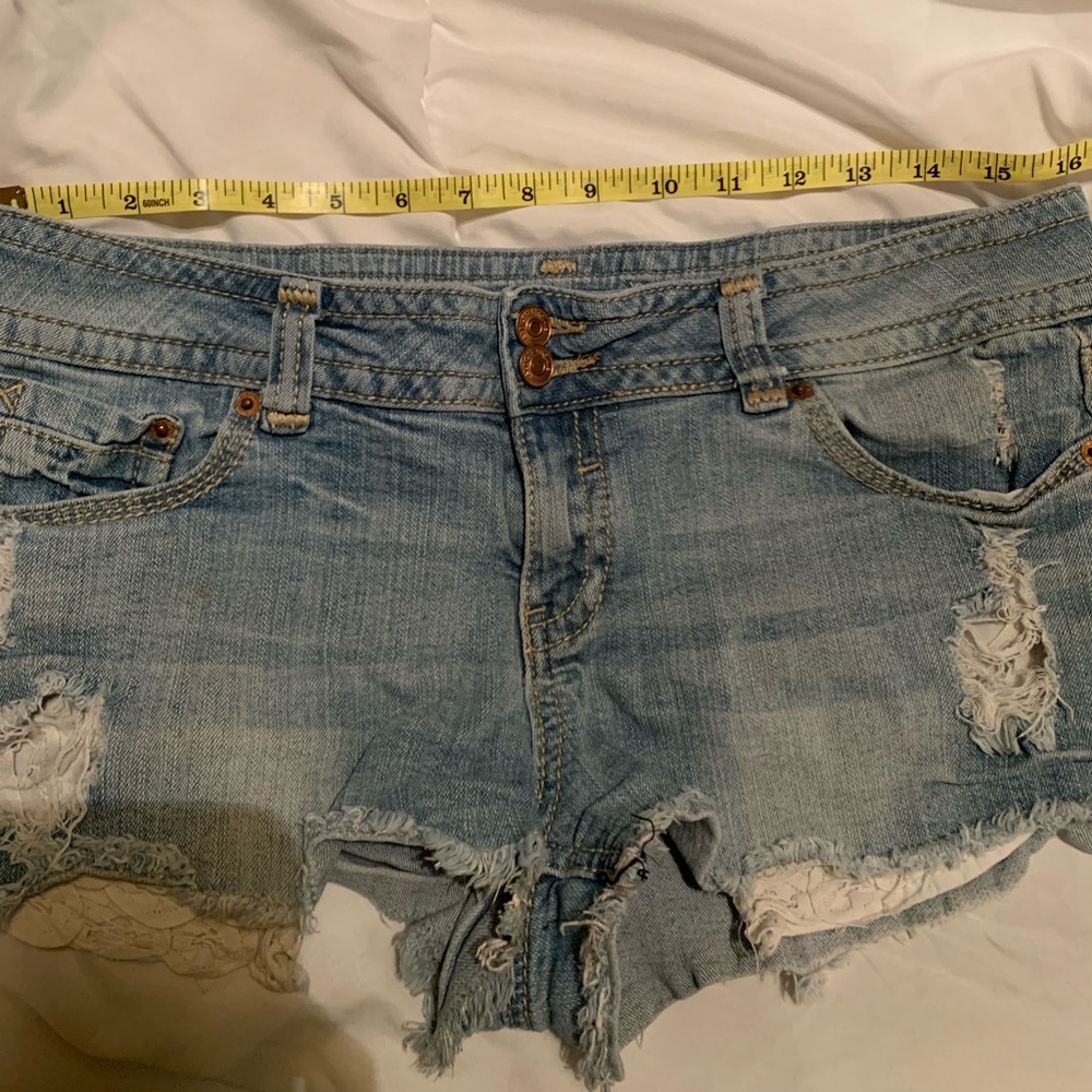 Almost famous shorts with lace pocket detailing.